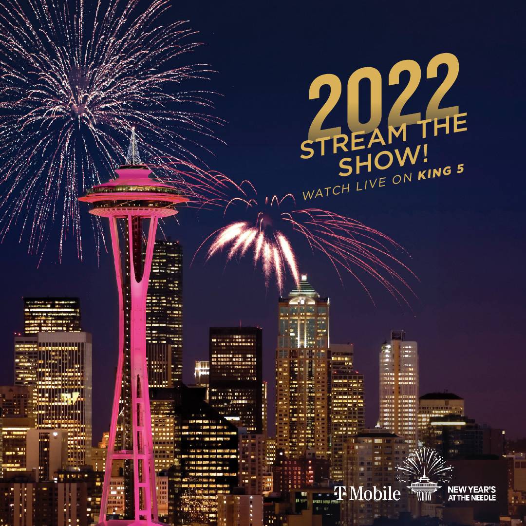 Fireworks, Seattle city buildings, lights, Space Needle, Text:  "2022 Stream the Show! Watch Live on KING 5"