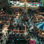 Overhead view of a Christmas village with decorations and lights.